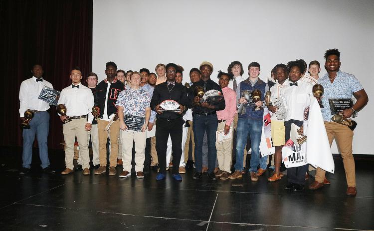 Sunshot by Grayson Williams - Hart County Football award winners show off their awards after the Hart County Football banquet on Jan. 16.Sunshot by Grayson Williams Hart County Football award winners show off their awards after the Hart County Football banquet on Jan. 16.