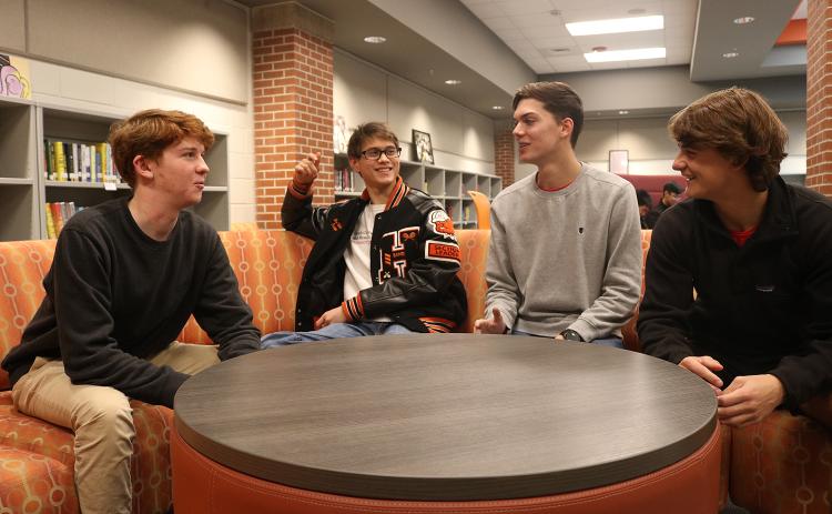 Leadership Hart Youth participants Sean Leard, from left, Ben Tellano, Adam Walters and A.J. Johnson talk about their project at Hart County High School recently.