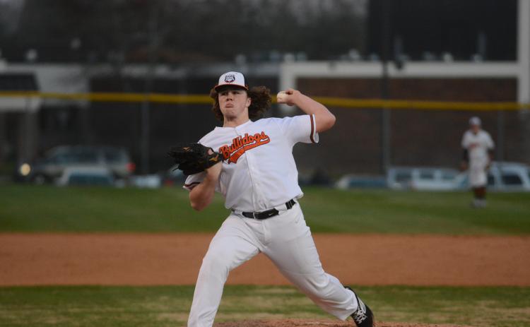 Sunshot by Grayson Williams - Hart County pitcher Peyton Powell deals on Friday, Feb. 14, at Saye Field at Hart County High School in the Diamond Dogs’ opening night win.
