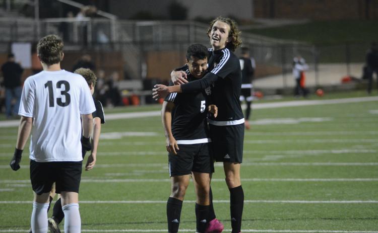 Sunshot by Grayson Williams Renso Escobedo, left, celebrates with Lincoln Zemaitis following Escobedo’s goal against Oglethorpe County at Hart County High School on Feb. 25.