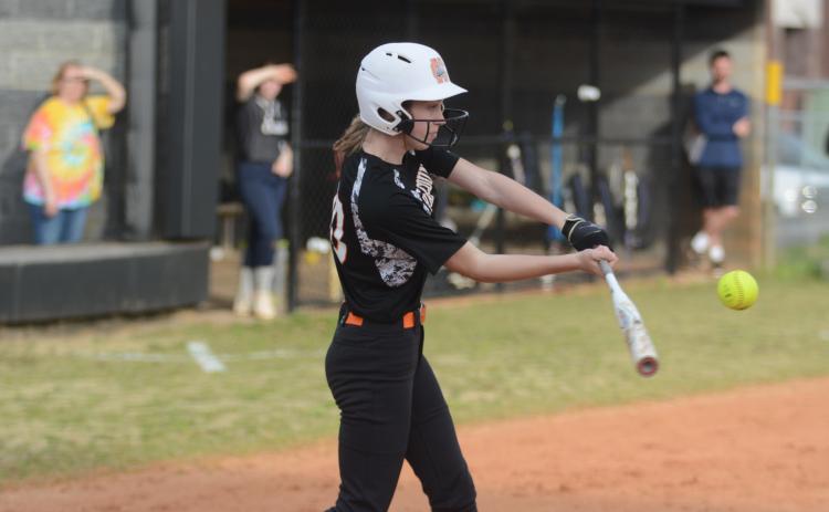 Sunshot by Grayson Williams - Emilee Sanders swings at a pitch in Hart County’s slow-pitch softball game last week against East Jackson.