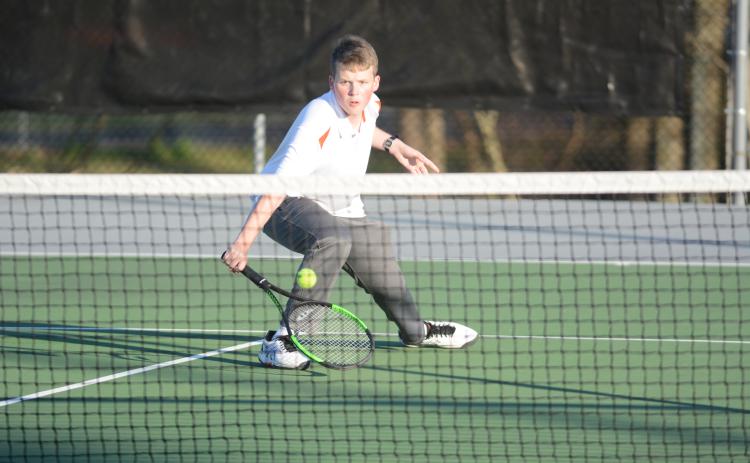 Sunshot by Grayson Williams - Hart County’s No. 2 singles player, Michael Floyd, returns a volley on March 6 at Hart County High School.