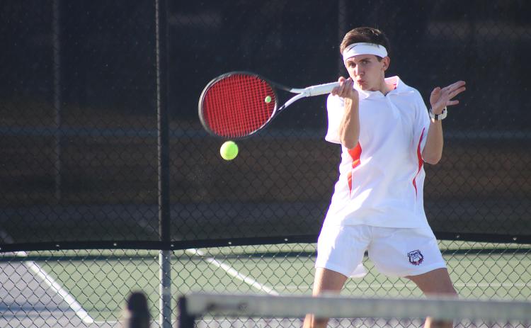 Sunshot by Grayson Williams - Hart County’s Zach Foley returns a ball in the No. 1 doubles match last Thursday against Madison County at Hart County High School.