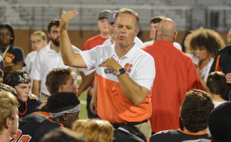 Hart County High School head football coach and athletic director, Rance Gillespie, talks to the Bulldog football team during a game against Jackson County in 2019.