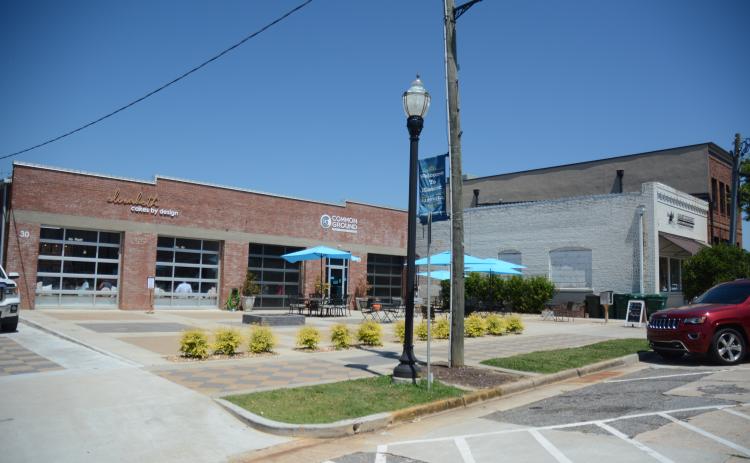 Sunshot by Michael Hall — Elizabeth Cakes by Design, left, Common Ground, middle and the Hart County Chamber of Commerce, right, are shown on Carolina Street in downtown Hartwell recently. A block party is scheduled for July 22 for those and other new businesses on the street.