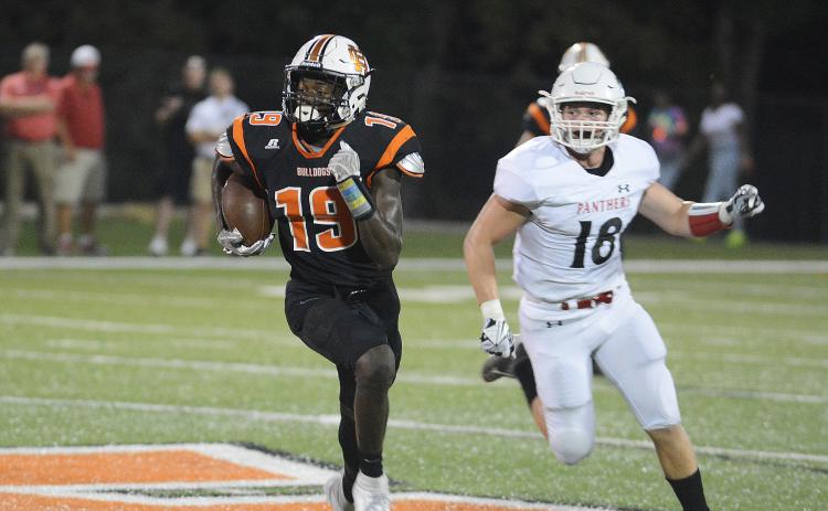 Malachi Thomas runs away from a Jackson County defender in October, 2019. Thomas committed recently to attend Virginia Tech. Sunshot from file