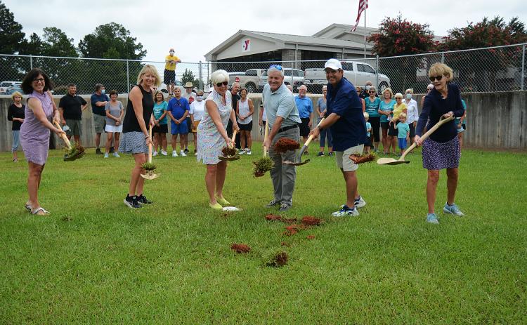 Sunshot by MIchael Hall - Above, Bell Family YMCA director Mandy Floyd, from left to right, and Lake Hartwell Pickleball Club members Angie Putman, Henley Cleary, president Eddie McCurley and Peggy Vickery break ground on what will become the club’s outdoor courts at the YMCA in Hartwell on Monday, Aug. 24.