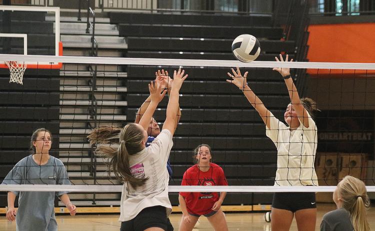 Sunshot by Grayson Williams — The Hart County volleyball team practices at the gym at Hart County High School on Monday, Aug. 3. The team is eyeing a deeper playoff run this season.
