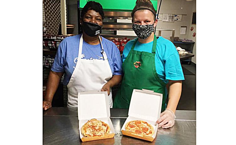 Photo submitted - Hart County Middle School cafeteria staff show off the new Smart Mouth Pizzas the school is serving this year.
