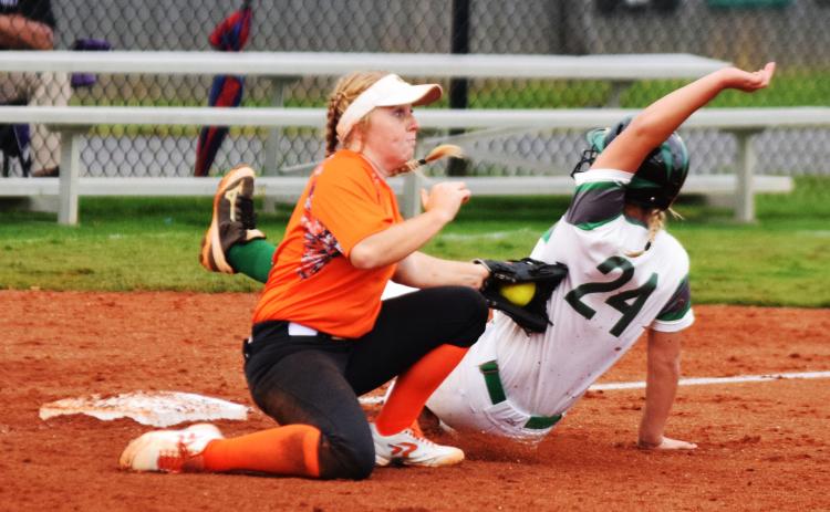 hoto by Shane Scoggins/Franklin Co. Citizen-Leader - Gabby Buffington tags a Franklin County base runner at third base on Sept. 24 in Carnesville.