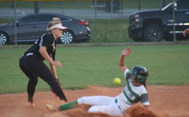 Sunshot by Grayson Williams - Hart County’s Anslee Mitchell fields a throw in an attempt to get a Franklin County base runner out on Sept. 3 in Franklin County.