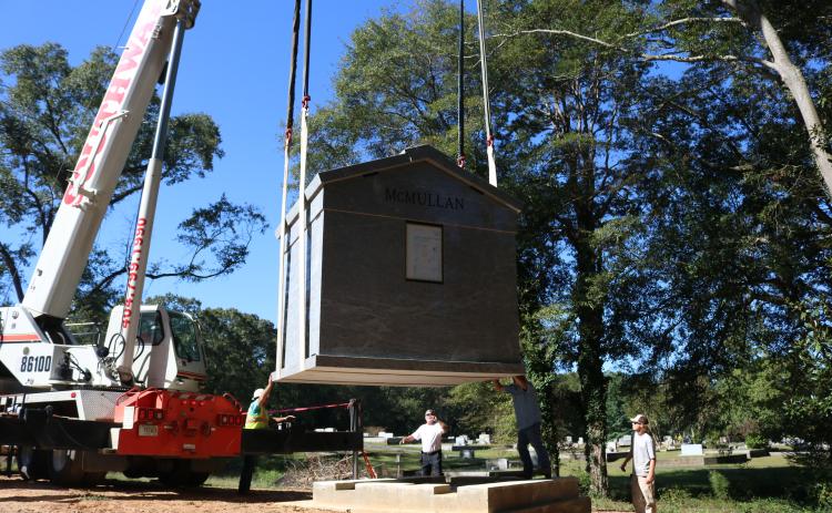 Sunshot by Grayson Williams - A 30-ton mausoleum is lowered with a crane onto its foundation at Northview Cemetery on Oct. 2.