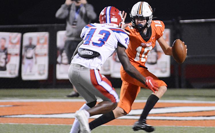 Sunshot by Michael Hall Quarterback Tanner Ayers tries to elude a Jefferson defender on Friday, Oct. 2, at Herndon Stadium in the Bulldogs’ 26-19 loss.