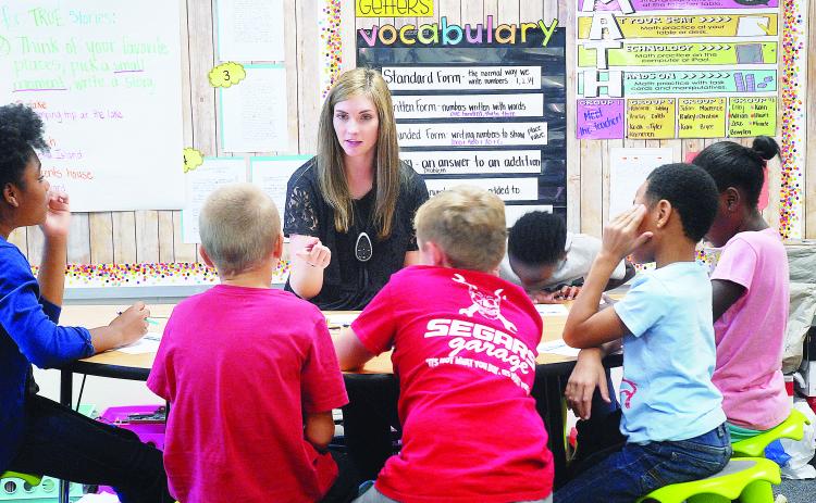 Sunshot from file - Andrea Gibbs works with students in her class in 2018 at Hartwell Elementary.