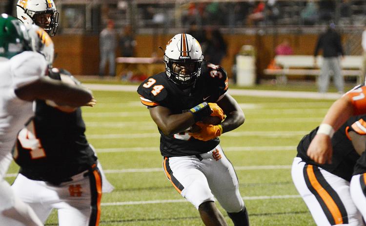 Hart County running back J.L. Lackey finds a hole to run through last week against Franklin County at Herndon Stadium.