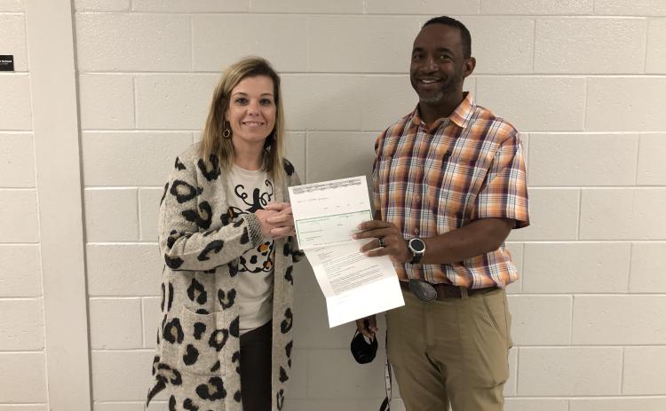 Pictured are seventh-grade math teacher at Hart County Middle School, Tommy Hughes, and principal Jacqueline Brock accepting the grant on behalf of the STEAM committee.