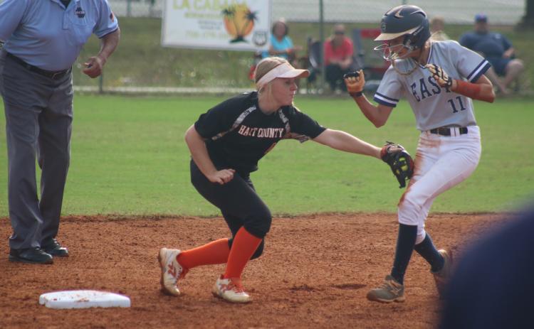 Sunshots by Grayson Williams Gabby Buffington tags an East Jackson runner out during the Lady Diamond Dogs’ victory in the Region 8-AAA tournament on Monday.