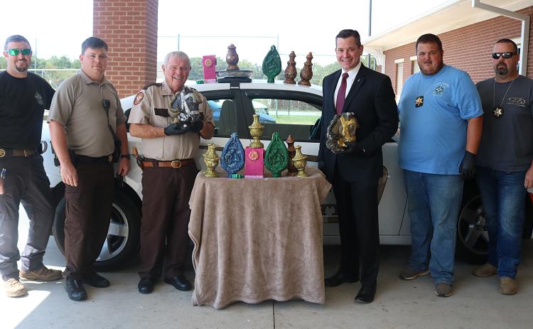 Pictured from left to right are, Inv. Chris Carroll, deputy Josh Fowler, Sheriff Mike Cleveland, District Attorney Parks White, Inv. Kevin White and Inv. Joseph Haley with 47 pounds of methamphetamine disguised as candles that were seized in September 2019.