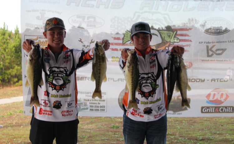 Joshua Haley and Jacob Fowler show off their catches in the middle school portion of the intra-squad tournament the Hart County middle and high school anglers competed in last weekend.  Photo submitted
