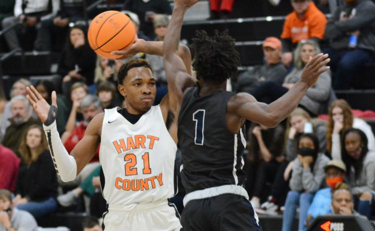 Sunshot by Michael Hall — Hart County’s Shone Webb pulls the ball back from an Elbert County defender at Hart County High School on Dec. 16 in the Bulldogs’ first win of the week over the rival Blue Devils.