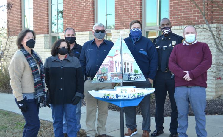 Sunshot by Drew Dotson - Pictured from left to right are Angela Short, Debbie Gurley, Dennis White, Ken Lystiuk, Jon Herschell, Anthony Davis and Jason Ford.