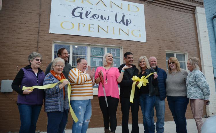 From left to right, TORCH board of directors members Nancy Butler, Mary Gidley and Joe Hoffman, Glow Up partners Laura McCarty and Jessica Fortson, Downtown Café owner Sharif Farhan and manager Melissa Dove, Hartwell city councilman Tray Hicks, Lake Hartwell Insurance’s Elizabeth Brewer and Winnie J’s owner Winnie Sullivan celebrate the ribbon cutting for Glow Up Tanning Salon, 47 Depot Street in downtown Hartwell.
