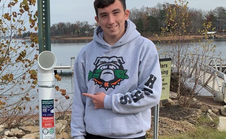 Photo submitted — Dawson Carden shows off one of the monofilmanet recycling stations he has placed at boat ramps around Lake Hartwell.