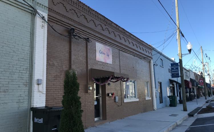 Sunshot by Drew Dotson - The exterior of Glow Up Tanning Salon is shown on Depot Street in downtown Hartwell.