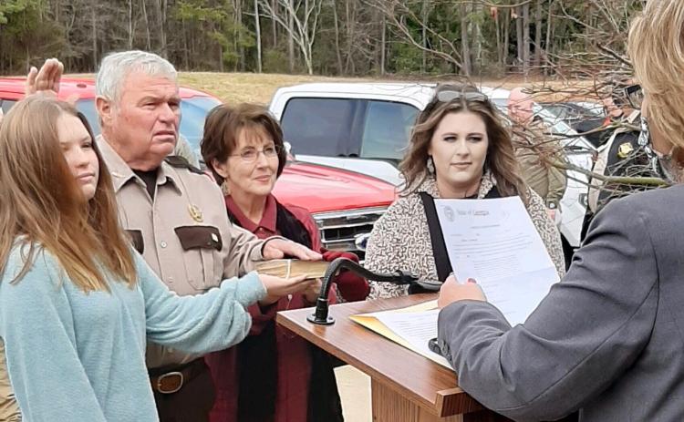 Pictured are, second from left, Cleveland, alongside, left, granddaughter Natalie Jo Morris, second from right, wife Coni Jo Cleveland, and, right, daughter Madison Morris.
