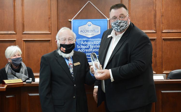 Sunshot by Michael Hall - Hart County Charter System superintendent, Jay Floyd, right, presents the Exemplary School Board award to board chairman Richard Sutherland.