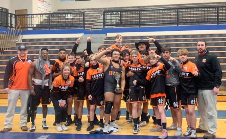 Photo by Mandy Patton - The Hart County High School wrestling team celebrates the school’s first region championship in duals wrestling in school history on Jan. 16 at Oconee County High School.
