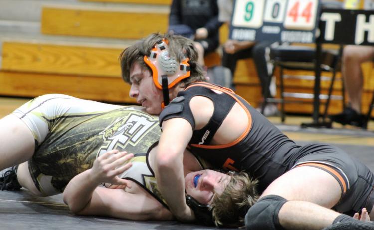 Photo submitted by Mandy Patton - Zander Bradsher wrestles against an opponent at a meet on Jan. 5.