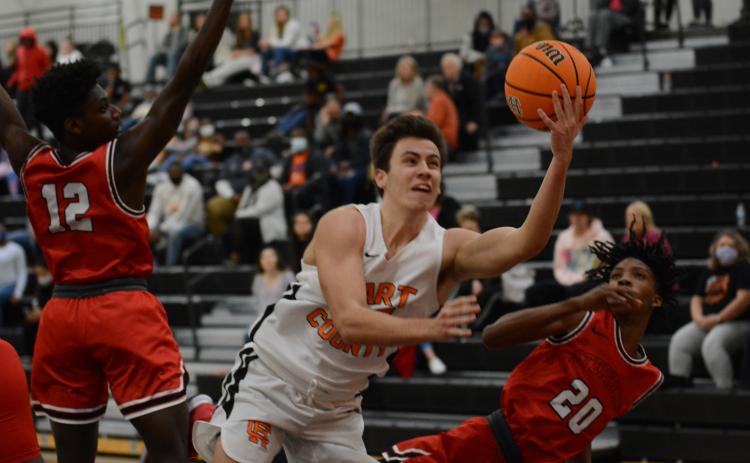Sunshot by Grayson Williams - Ethan Spagnoli puts up a shot against Stephens County at Hart County High School on Tuesday.
