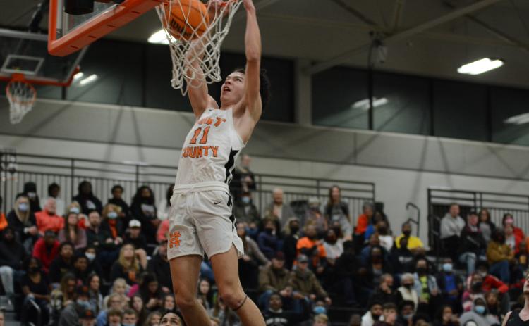 Sunshot by Grayson Williams - J.C. Curry throws down a dunk last week at Hart County High School in the Bulldogs’ win over rival Franklin County to finish an undefeated season in Region 8-AAA play.