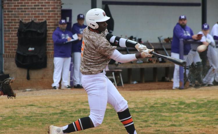 Sunshot by Grayson Williams - Hart County’s Paul Davis makes contact in a region-road game against Monroe Area on Friday, March 19.