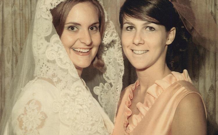 Bride Pam Shirah shares a smile with her maid of honor, Judy Mizell, on Aug. 23, 1969. Today, Pam S. NeSmith and Judy M. Wolbe celebrate a collective 102 years of marriage to the men they dated in college.