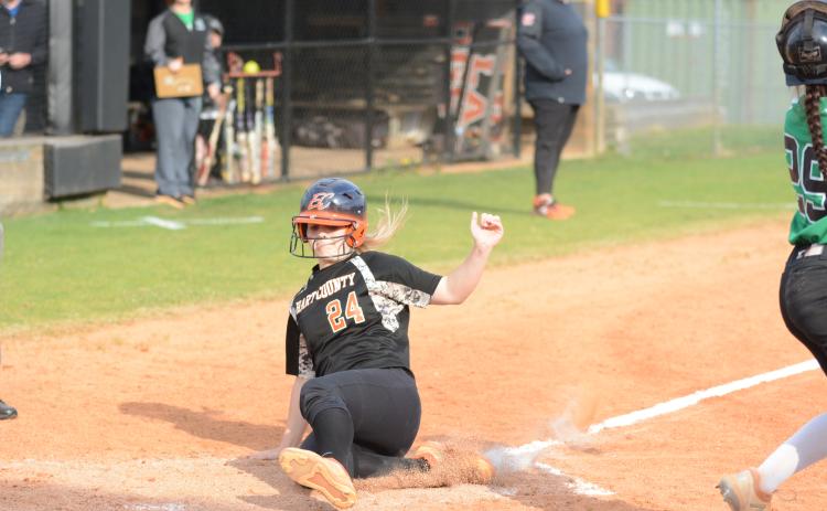 “Boo” Mitchell slides into home plate in the softball team’s victory over rival Franklin County.