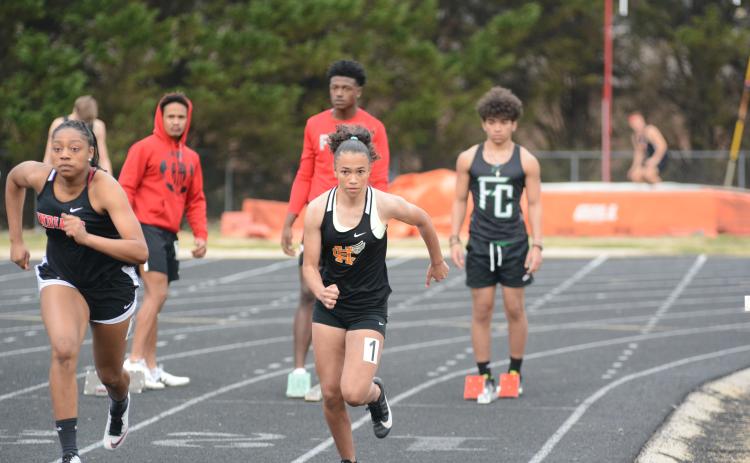 Kiera Jester competes in the 100-yard dash in the girls’ track team’s 1st-place finish.
