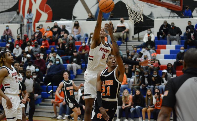 Sunshots by Grayson Williams - Hart County’s Shone “Spudd” Webb is blocked in a layup attempt on Friday, March 5, by Sandy Creek’s Jabari Smith, who is committed to play at Auburn in college.