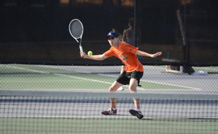 Sunshot by Grayson Williams No. 1 singles player C.J. Jorensen returns a volley against Franklin County on March 18 at Hart County High School.