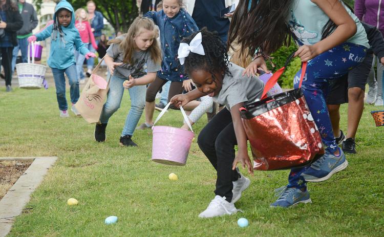 Sunshot from file: Amiracle Roebuck, 5, finds room to grab an egg during the Hart County Chamber of Commerce’s annual Easter egg hunt in 2019.