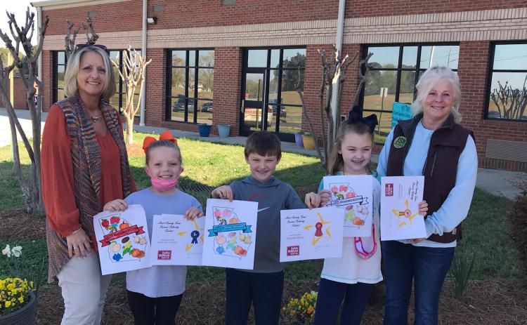 Submitted photo Pictured: left to right in the Coloring Contest: Angela Wood, HCFB Office Manager, 1st place – Bailey Driscoll, 2nd - Grayson Morris, 3rd – Millie Colson and Patti York, HCFB Women’s Committee Chair.