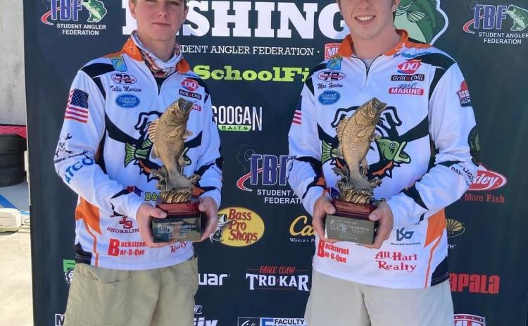 Photo submitted - Tallis Morrison, pictured left, and Max Heaton, right, pose for a photo with their first-place tropies after winning the Student Angler Federation’s regional qualifer over the weekend on Lake Hartwell.
