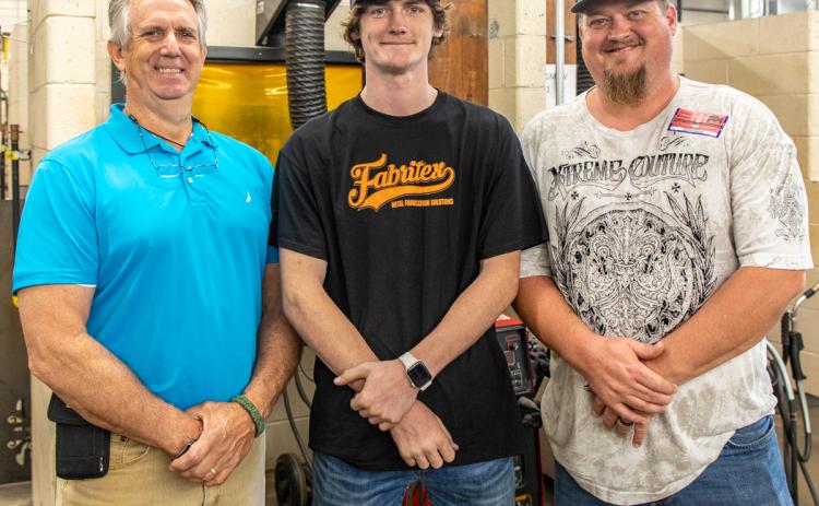 Photo submitted - Welding student Austin Brown recently took home first place in a welding competition. Pictured from left to right are welding instructor Mike Carey, Austin Brown, and Austin’s father, Ryan.