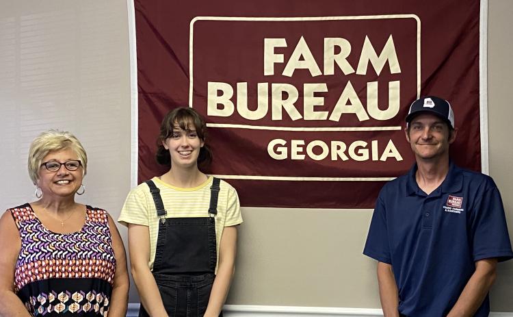 Submitted photo - From left to right, Farm Bureau office manager Tina Simmons, award winner Sydney Smith and Young Farmer & Rancher chairman Brian Fleming.