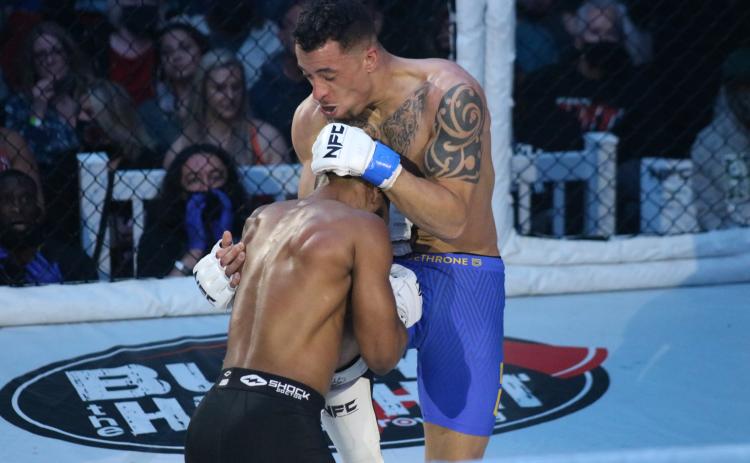 Sunshot from file - Tyler Barber throws a knee to his opponent’s mid-section in a previous NFC fight on March 20 in Atlanta. Barber fights again on June 12 in Anderson, S.C. at NFC 133.