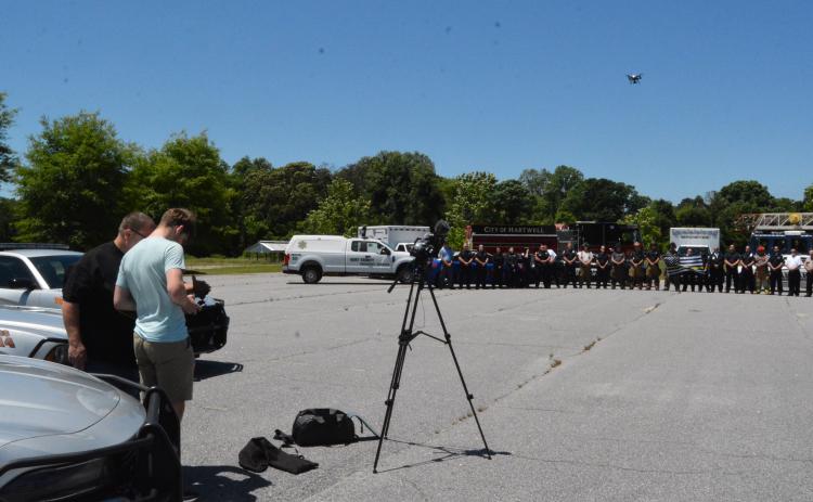 Drew Dotson/The Hartwell Sun Hart County High School media instructor Greg Gaines, left,  directs drone pilot Adian Stovall on how to capture the shot he wants.