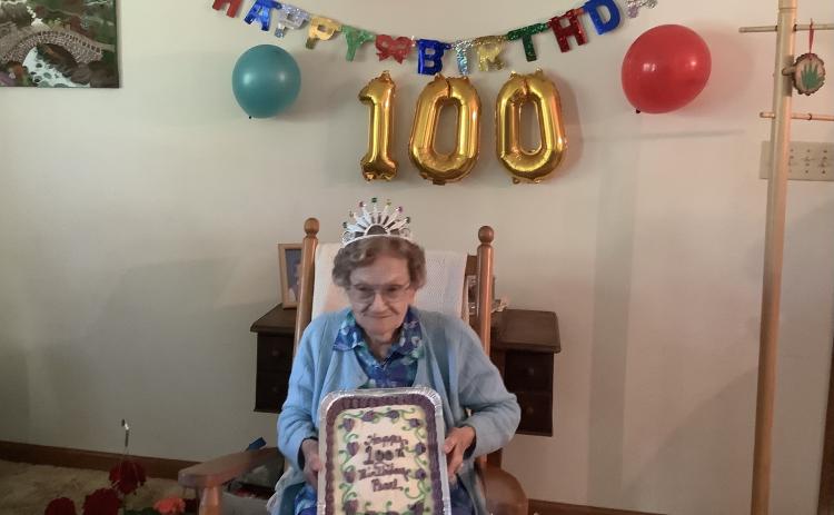 Submitted photo - Longtime area resident Pearl Bond celebrates her birthday with a cake from her friends who threw her a neighborhood party attended by about 30.
