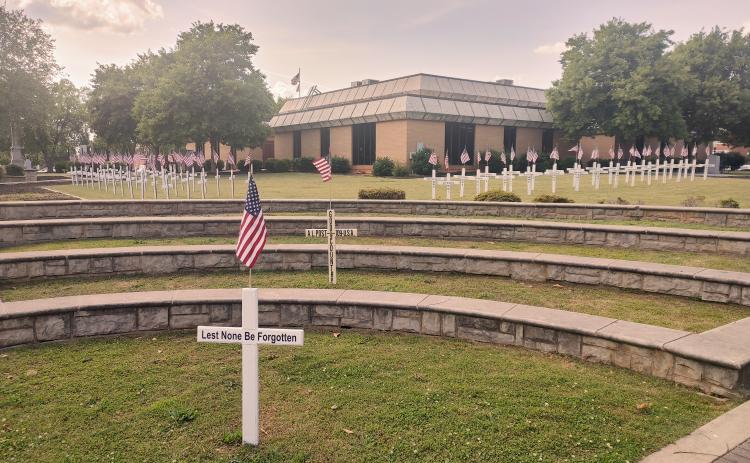 Dan Hunt/The Hartwell Sun - Crosses placed in memory of fallen area veterans line the front of the Hartwell courthouse in recognition of Memorial Day.