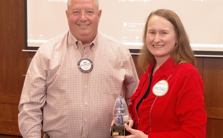 Dan Hunt/The Hartwell Sun - Ruth Daniel (right) receives the rare Service Above Self Award from Rotary president Mike Everett at Cateechee Golf Club on May 5.